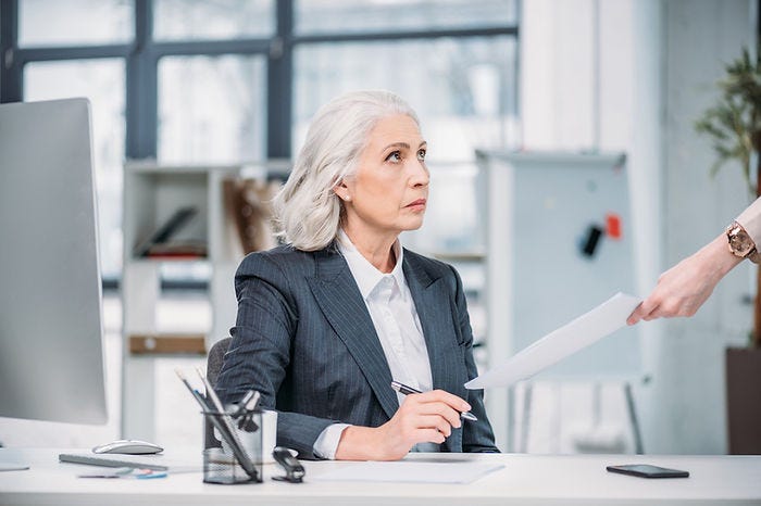 An older woman in the office and concerned about discrimination