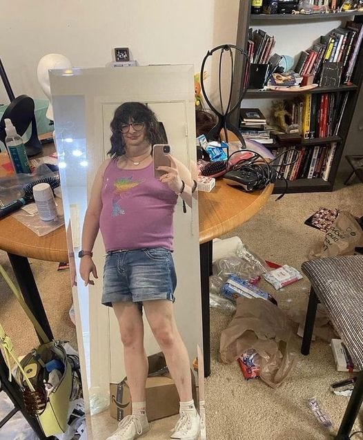 May be an image of 1 person, standing and indoor