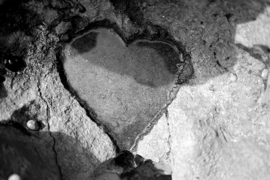 a heart shaped hole in a rock wall a heart shaped hole in a rock wall