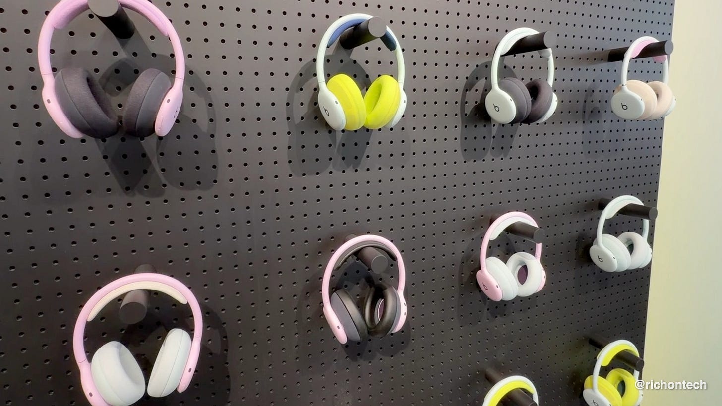 Beats 360 headphones displayed in several color combinations, showing the interchangeable ear cushions that can be swapped for workouts or everyday use.