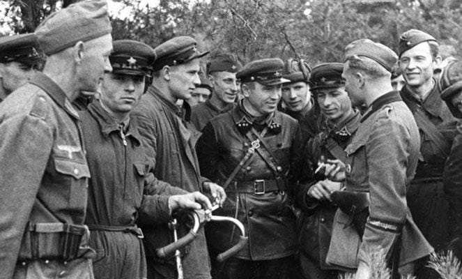 Soviet and Nazi soldiers converse after their joint invasion of Poland, 1939. Soviet and Nazi soldiers converse after their joint invasion of Poland, 1939.