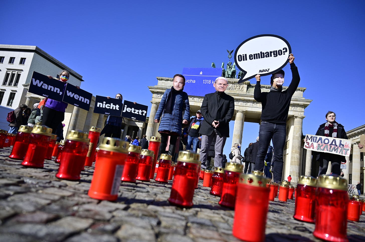 Activists light candles for the victims of Bucha as they demonstrate with masks of German Finance Minister Christian Lindner, German Chancellor Olaf Scholz and German Minister of Economics and Climate Protection Robert Habeck, in Berlin, on April 8, 2022. (Photo by John MacDougall/AFP via Getty Images) Activists light candles for the victims of Bucha as they demonstrate with masks of German Finance Minister Christian Lindner, German Chancellor Olaf Scholz and German Minister of Economics and Climate Protection Robert Habeck, in Berlin, on April 8, 2022. (Photo by John MacDougall/AFP via Getty Images)