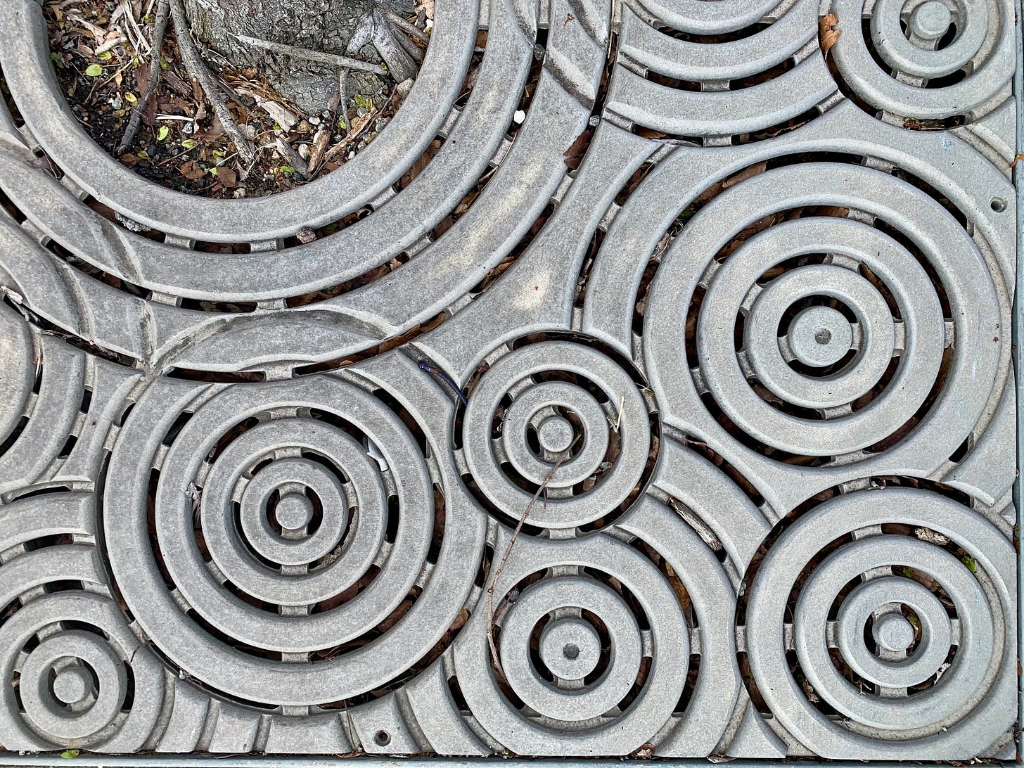 a curious pattern in a metal grate that reminded me of boombox speakers!