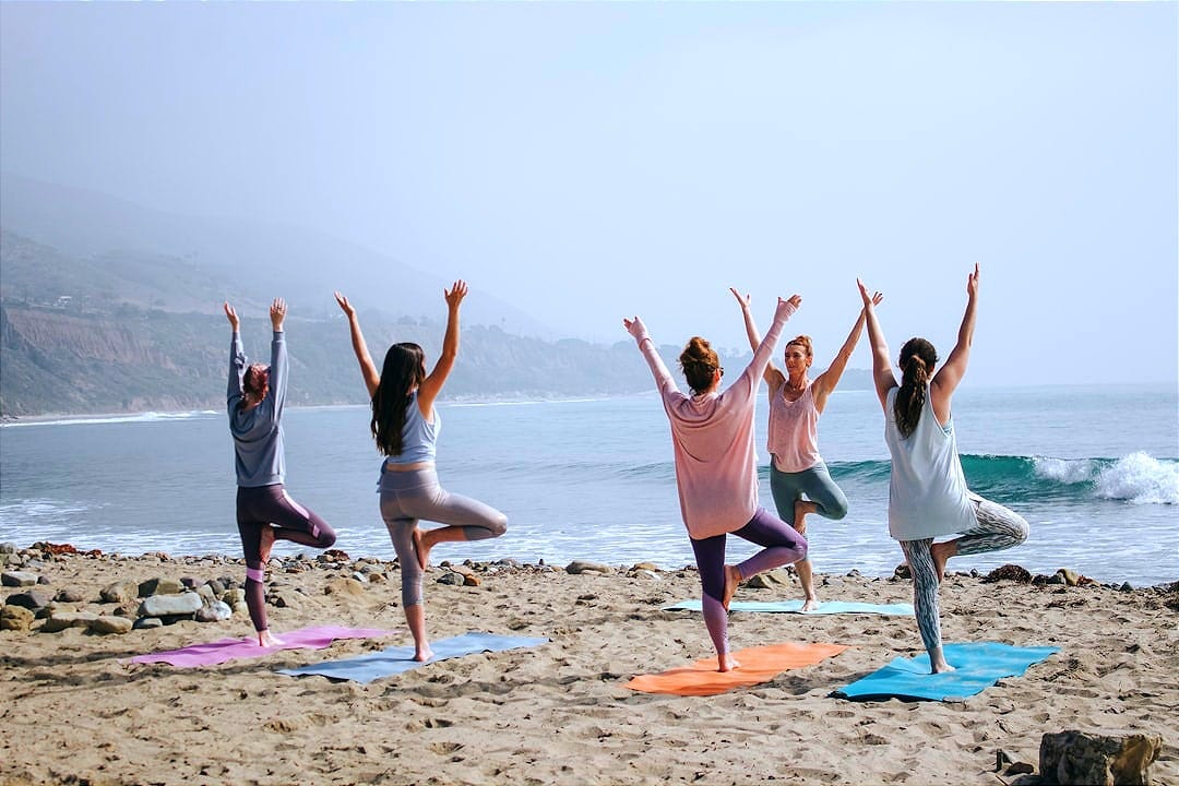 five woman standing on seashore five woman standing on seashore