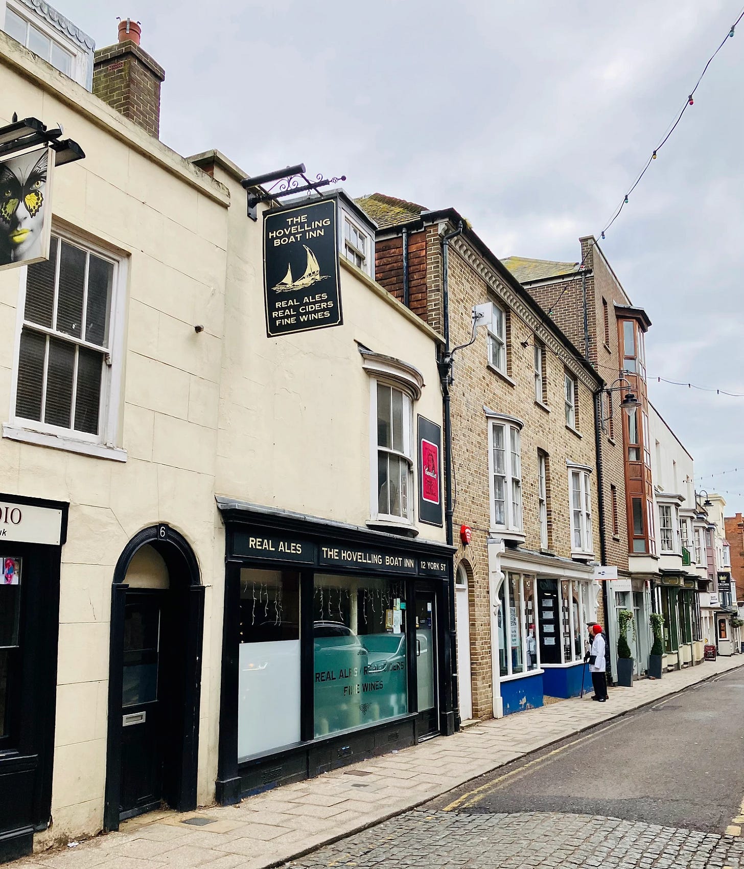 The pub, with its big glass ex-shopfront windows, leading out onto York Street on a cloudy day