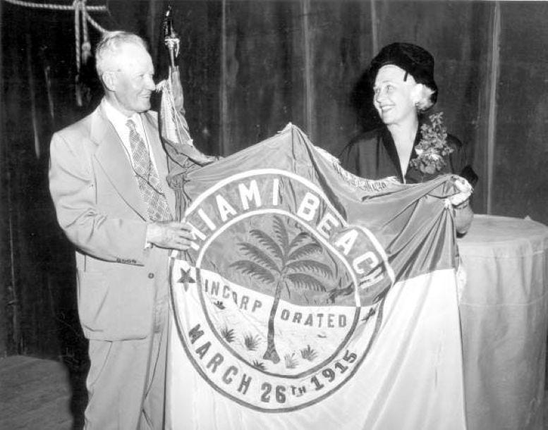 Jane Fisher in 1950 holding a Miami Beach flag to commemorate the city’s incorporation on March 26, 1915. Courtesy of Florida State Archives.
