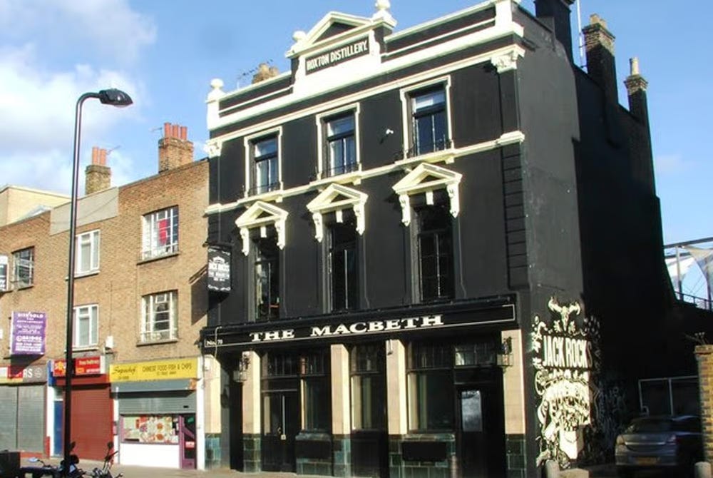 Exterior of the Macbeth - a handsome three storey end of terrace building painted black and cream