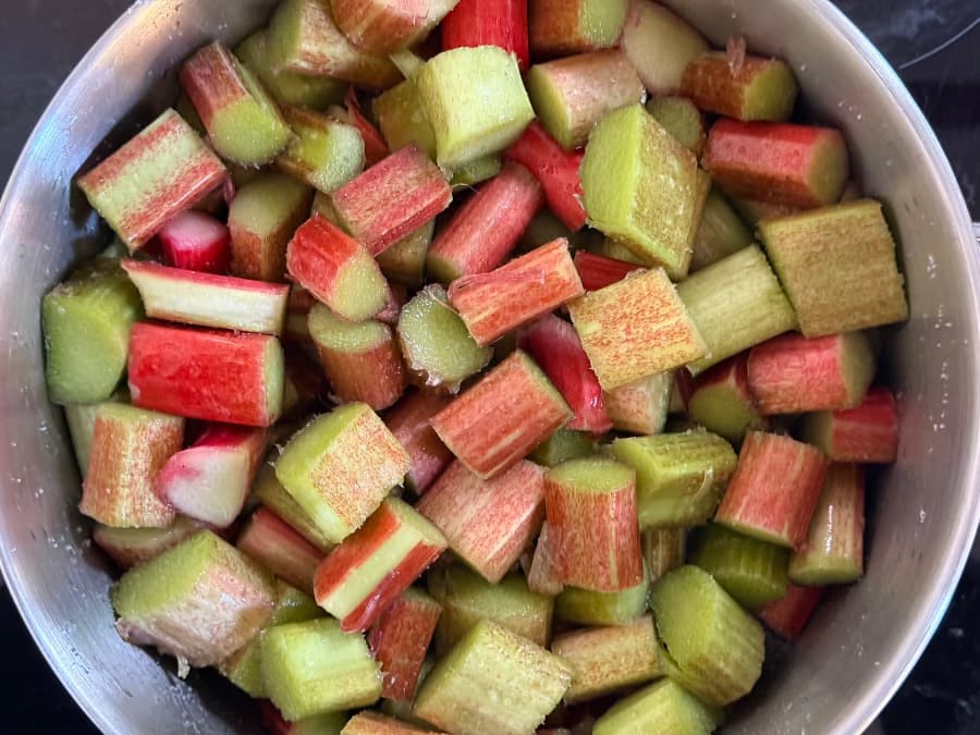 A pan filled with chopped rhubarb A pan filled with chopped rhubarb