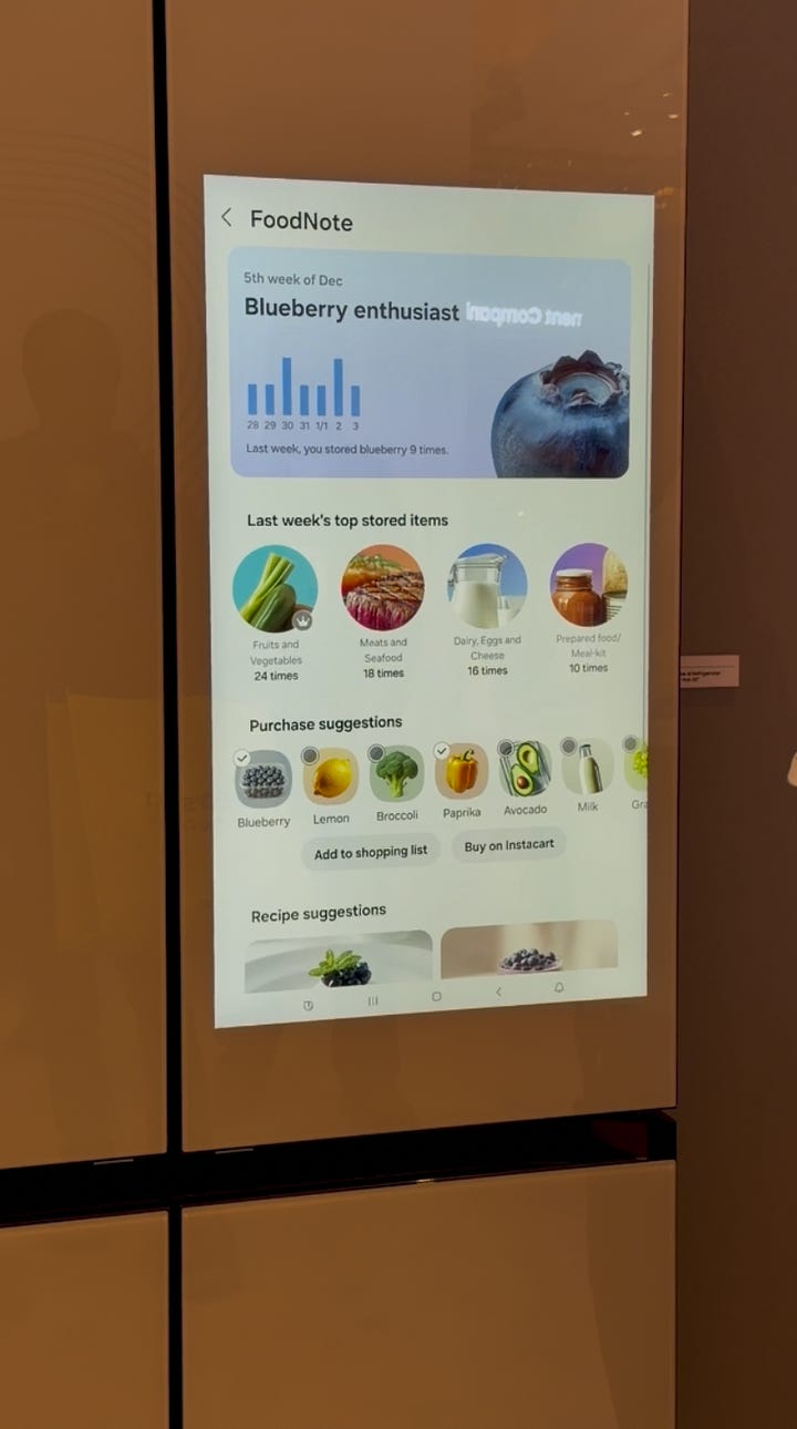 A Samsung AI Family Hub refrigerator displays a recipe for Crispy Caprese Tomato Tart on its touchscreen, while a person points to the ingredient list.