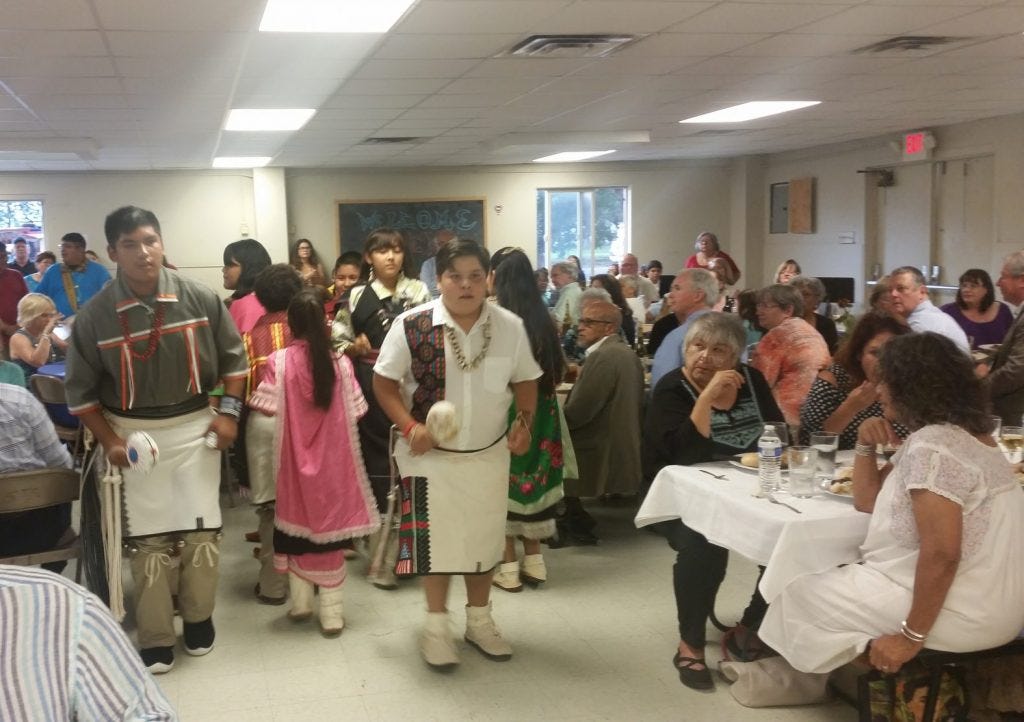 St. Joseph School students perform traditional dances for guests. Photo by Herb Mosher.