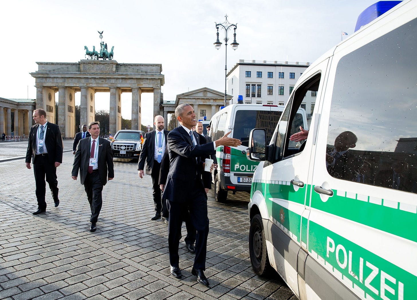 November 17, 2016: President Obama takes an impromptu walk through Berlin, Germany, past the Brandenburg Gate, to greet local police, following lunch at the U.S. Embassy. November 17, 2016: President Obama takes an impromptu walk through Berlin, Germany, past the Brandenburg Gate, to greet local police, following lunch at the U.S. Embassy.