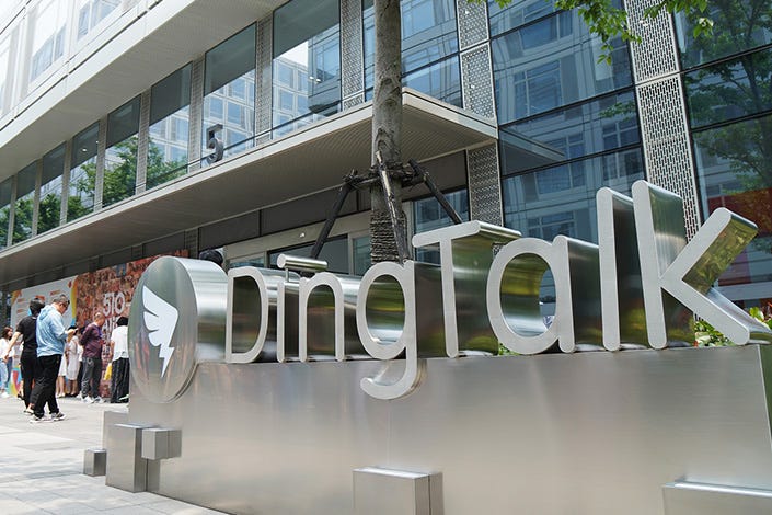 Pedestrians pass by a DingTalk sign in Hangzhou, East China’s Zhejiang province, in 2021. Photo: VCG