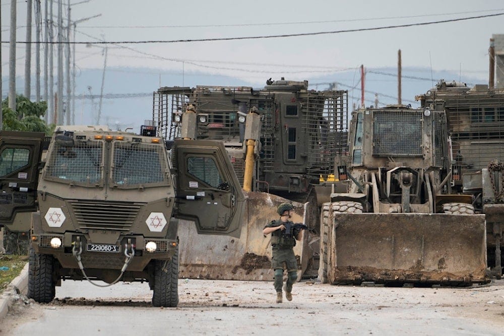 Israeli occupation forces vehicles are seen during a military operation in the West Bank city of Jenin, Wednesday, Jan. 22, 2025 (AP) Israeli occupation forces vehicles are seen during a military operation in the West Bank city of Jenin, Wednesday, Jan. 22, 2025 (AP)
