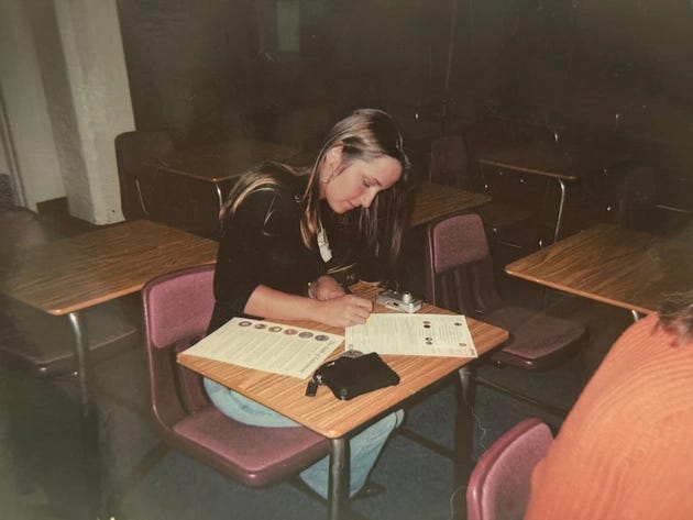 Courtney Williams signs documents.