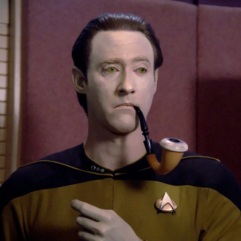 Image of the android Data from Star Trek with a comically oversized tobacco pipe.