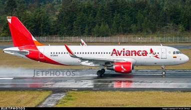 A white and red airplane on a runway

AI-generated content may be incorrect.