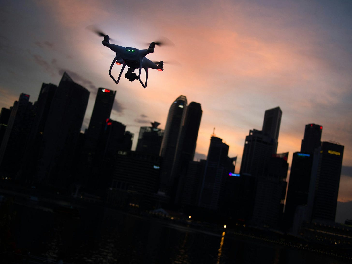 Flying a drone at dusk in the city Flying a drone at dusk in the city