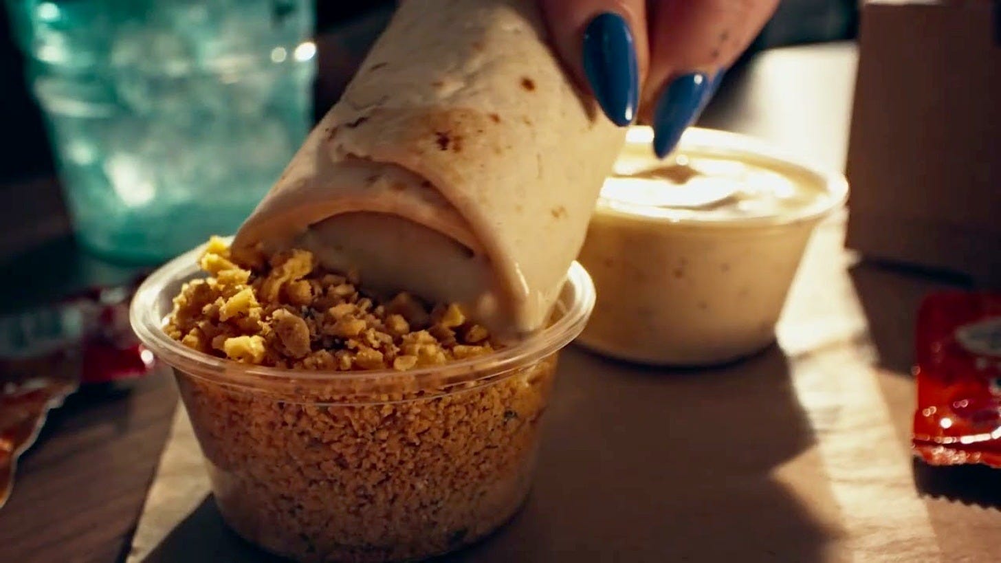 Double Dipping Burritos in a Taco Bell Canada ad. Image: Taco Bell Double Dipping Burritos in a Taco Bell Canada ad. Image: Taco Bell