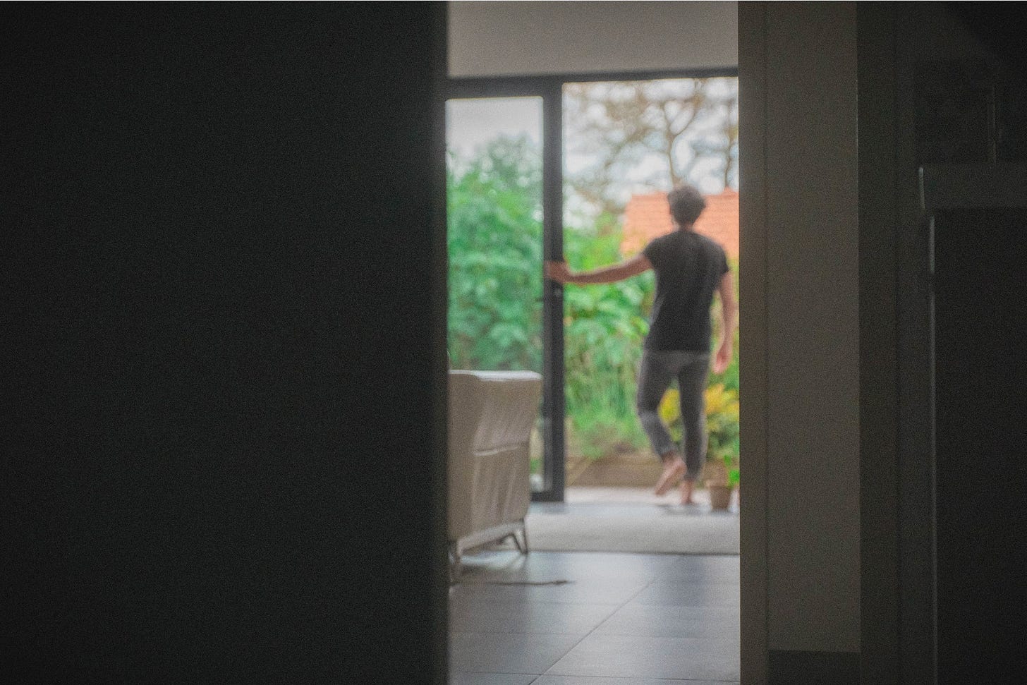 Person walking out on the terrace