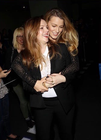 At the premiere of Amber's film "Paint It Black' in 2017. Blake and Amber laugh as Blake hugs Amber from behind.