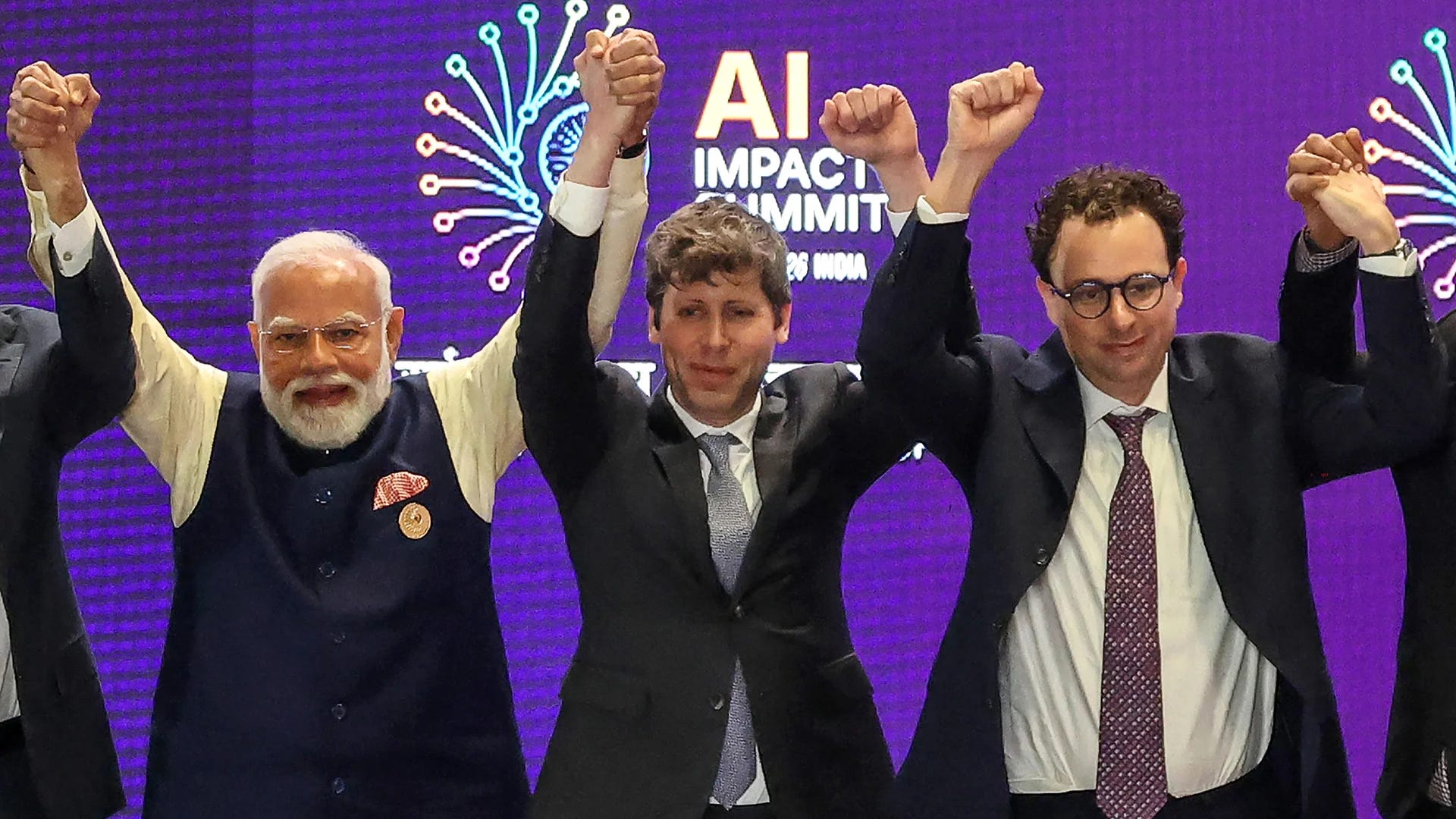 Sam Altman and Dario Amodei Refused to Hold Hands on Stage—and the Internet  Is Losing It