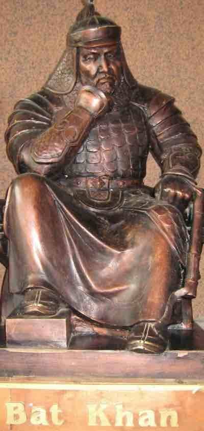 A statue of Batu Khan wearing Mongol armour and traditional attire.