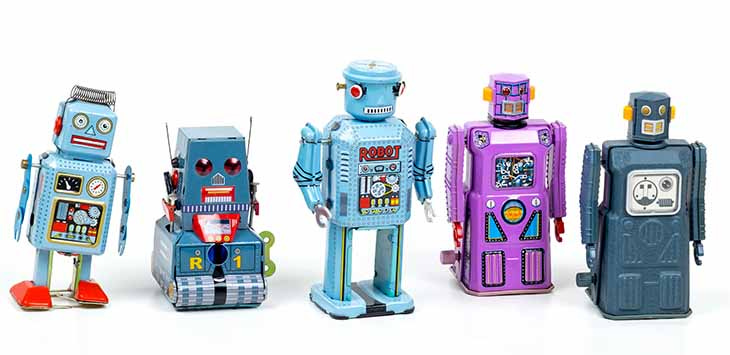 Photo of a row of toy robots.
