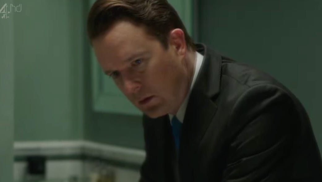 A person in a suit

AI-generated content may be incorrect.