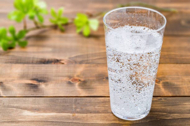 Carbonated Water On Wood Grain Background Stock Photo - Download Image Now  - Carbonated Water, Soda, Carbonated - iStock