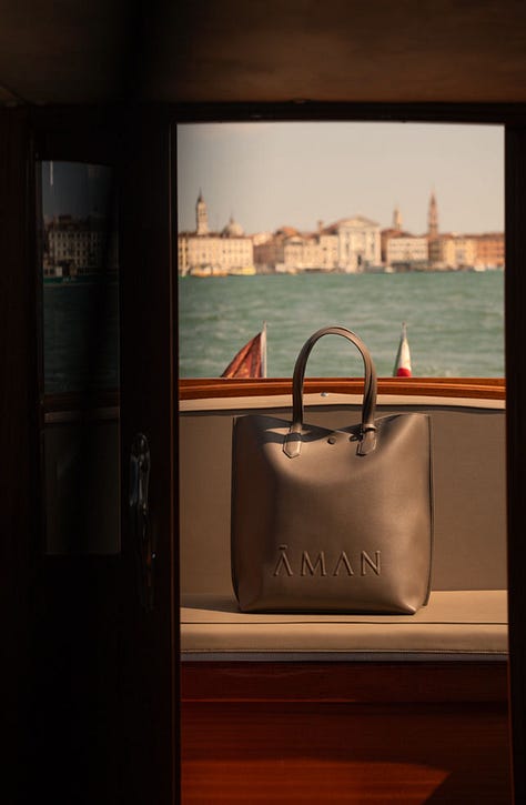 Aman Venice — water taxi, frescoed palazzo interiors, Murano chandelier, piano, and atmospheric details. Photographs by Sara Montalbano and Konstantinos Maximiadis.