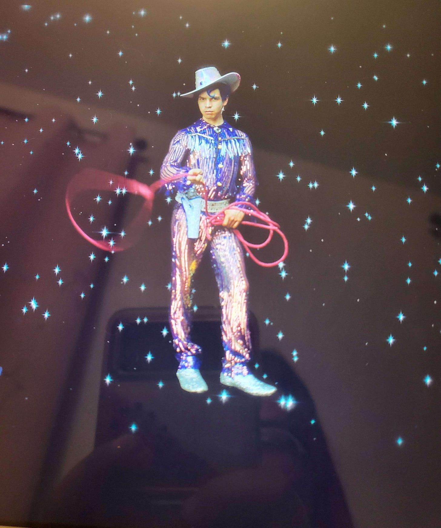 Julio Torres as Andrés in Los Espookys wearing a sparkly vaquero outfit with a lasso
