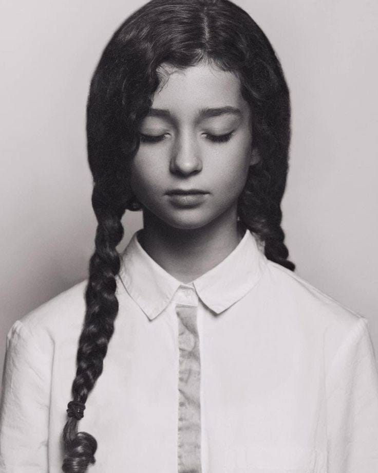 May be a black-and-white image of 1 person, braids and child