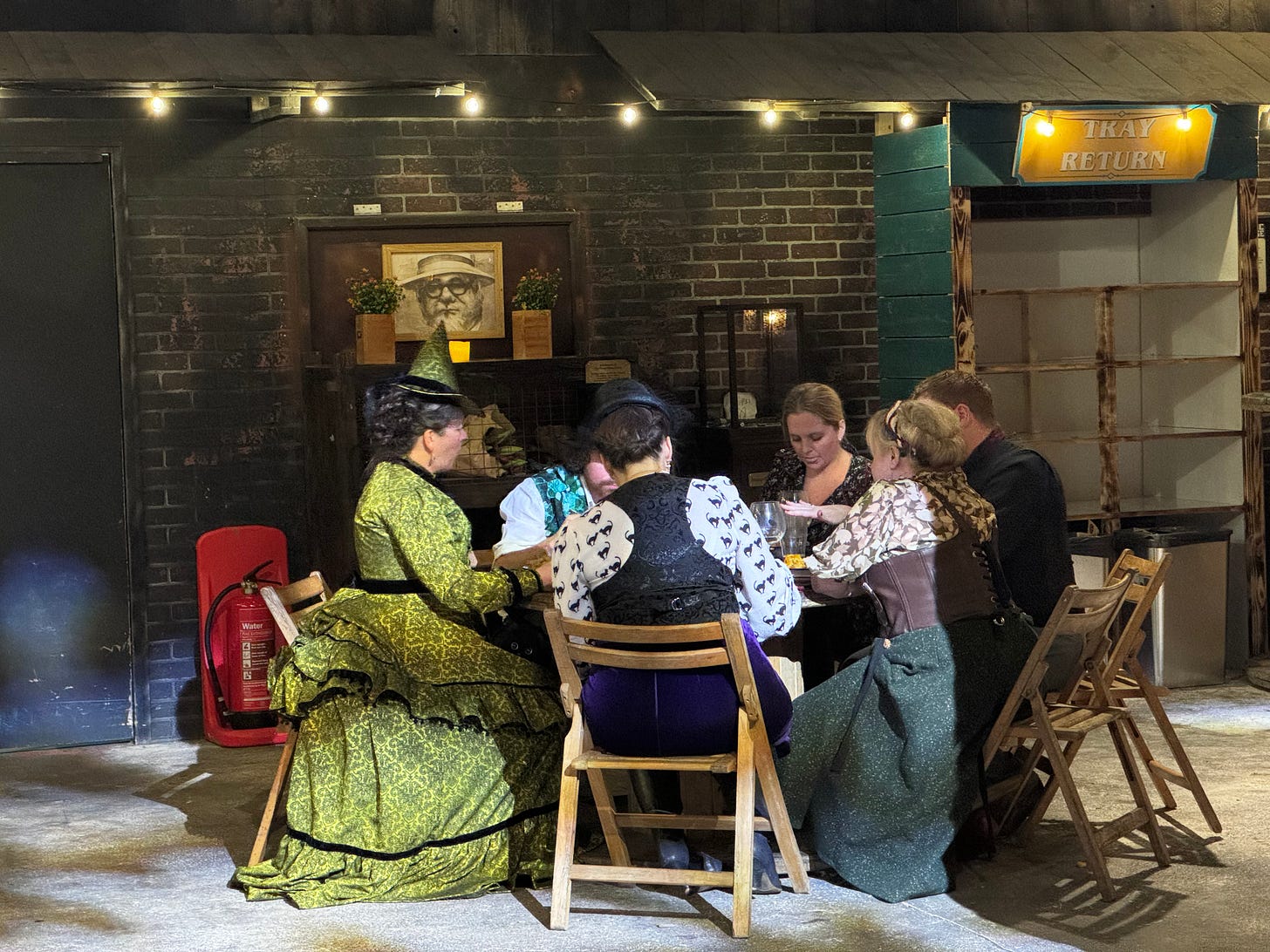 Cosplayers sitting around a table