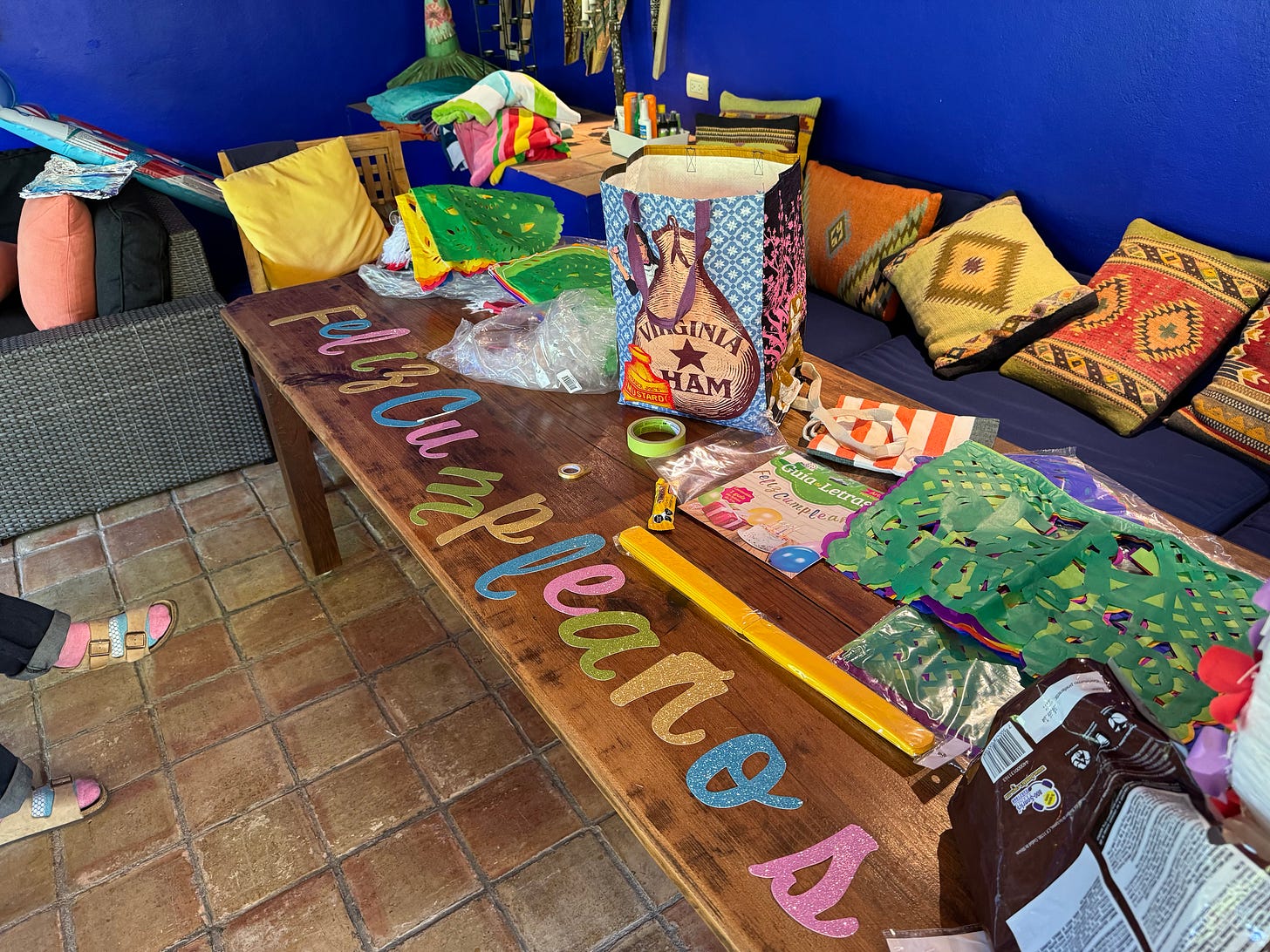 The wood table in the palapa covered with decorations.