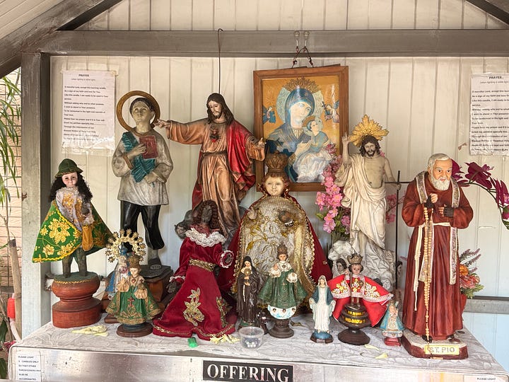 Statues at a Christian and a Folk Altar in Taiwan