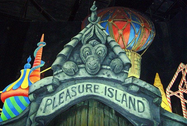 This may contain: the entrance to pleasure island is decorated with colorful balloons and other decorations, including hot air balloons