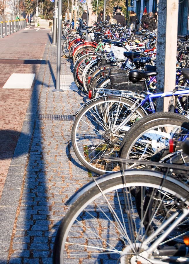 Bicycles tied side by side editorial image. Image of bolt - 125437000