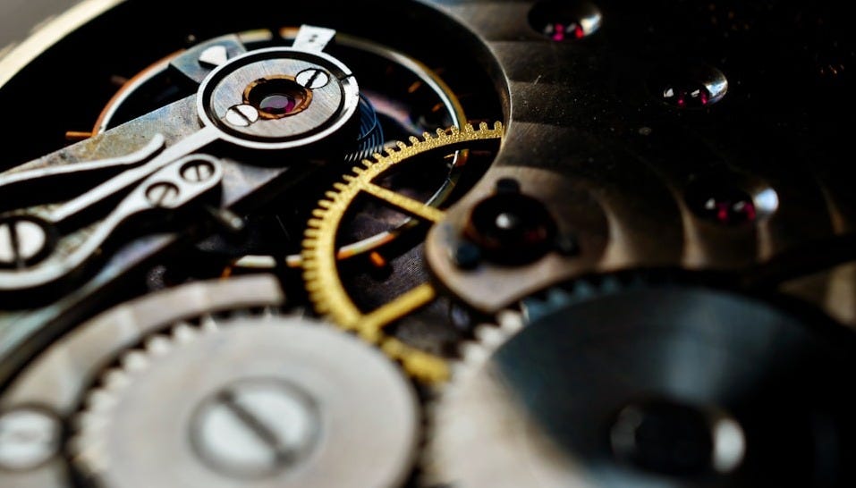 a close up of a watch face with the gears missing