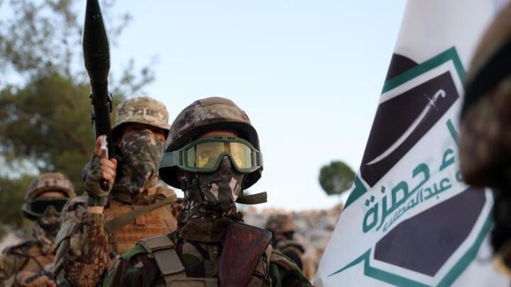 Fighters from the jihadist group Hayat Tahrir al-Sham (HTS), headed by ex-members of Syria's former Al-Qaeda franchise, on August 16, 2023.