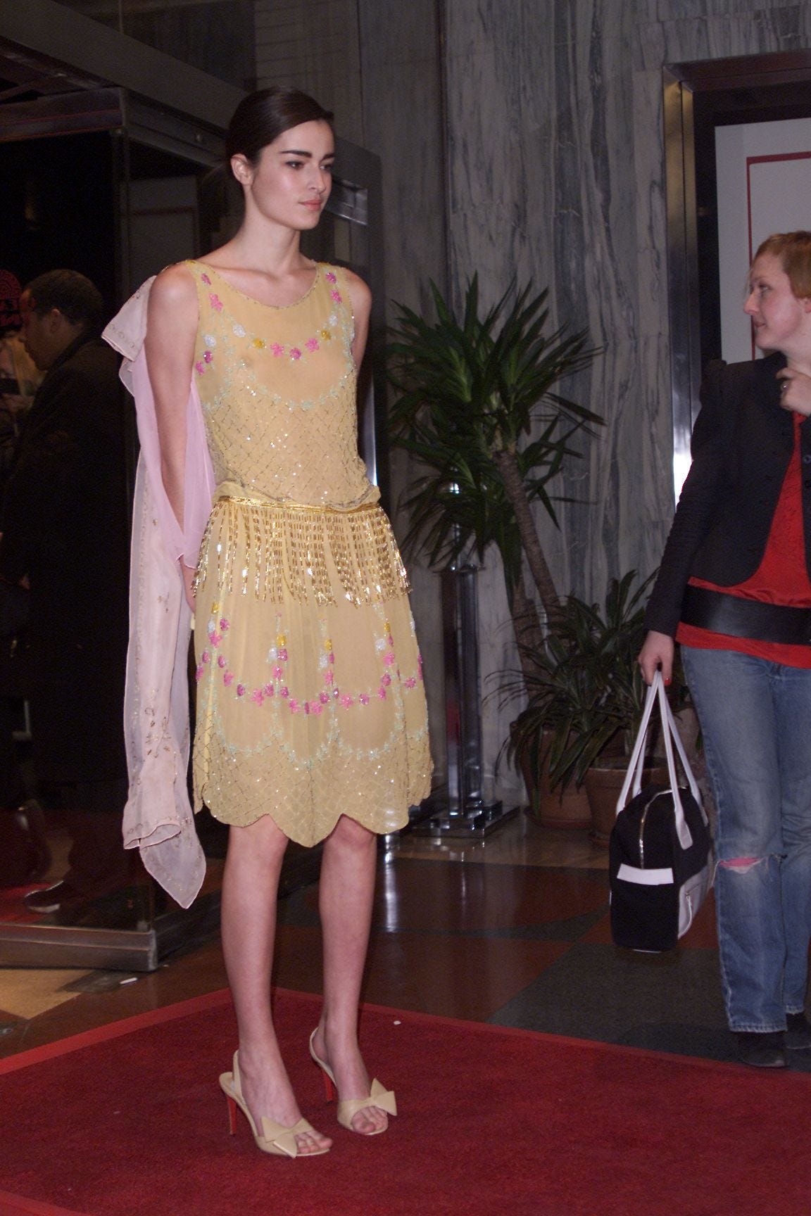 This image may contain Skirt Clothing Apparel Human Person Evening Dress Fashion Gown Robe and Pants