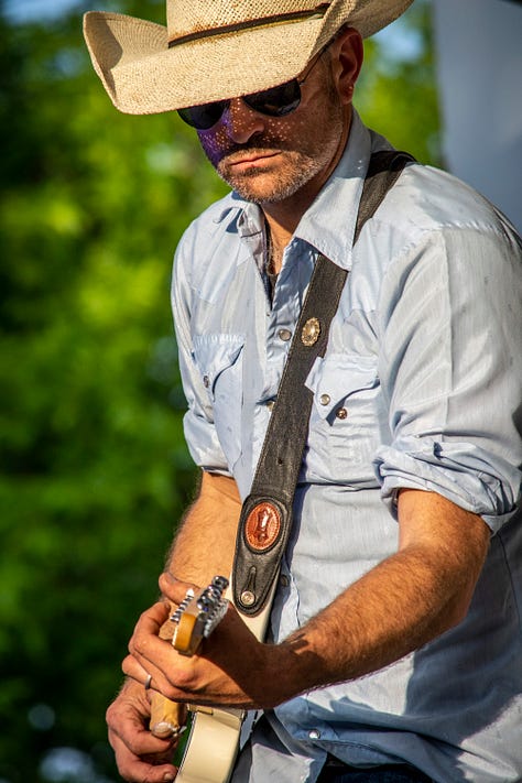 musicians onstage playing country music