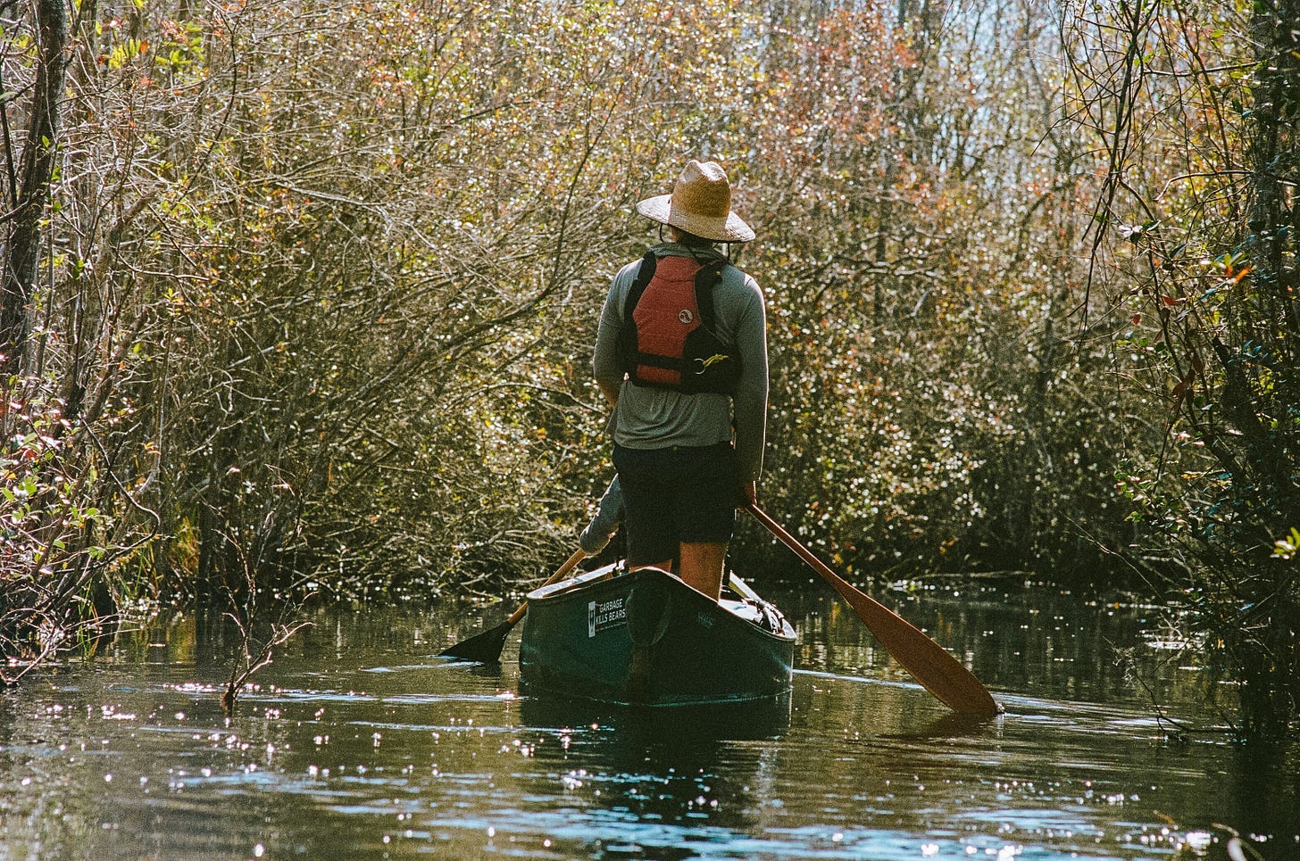 A person in a boat on a river

AI-generated content may be incorrect.