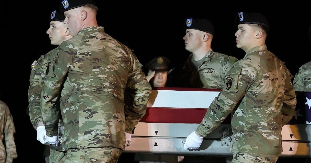 May be an image of military uniform and text