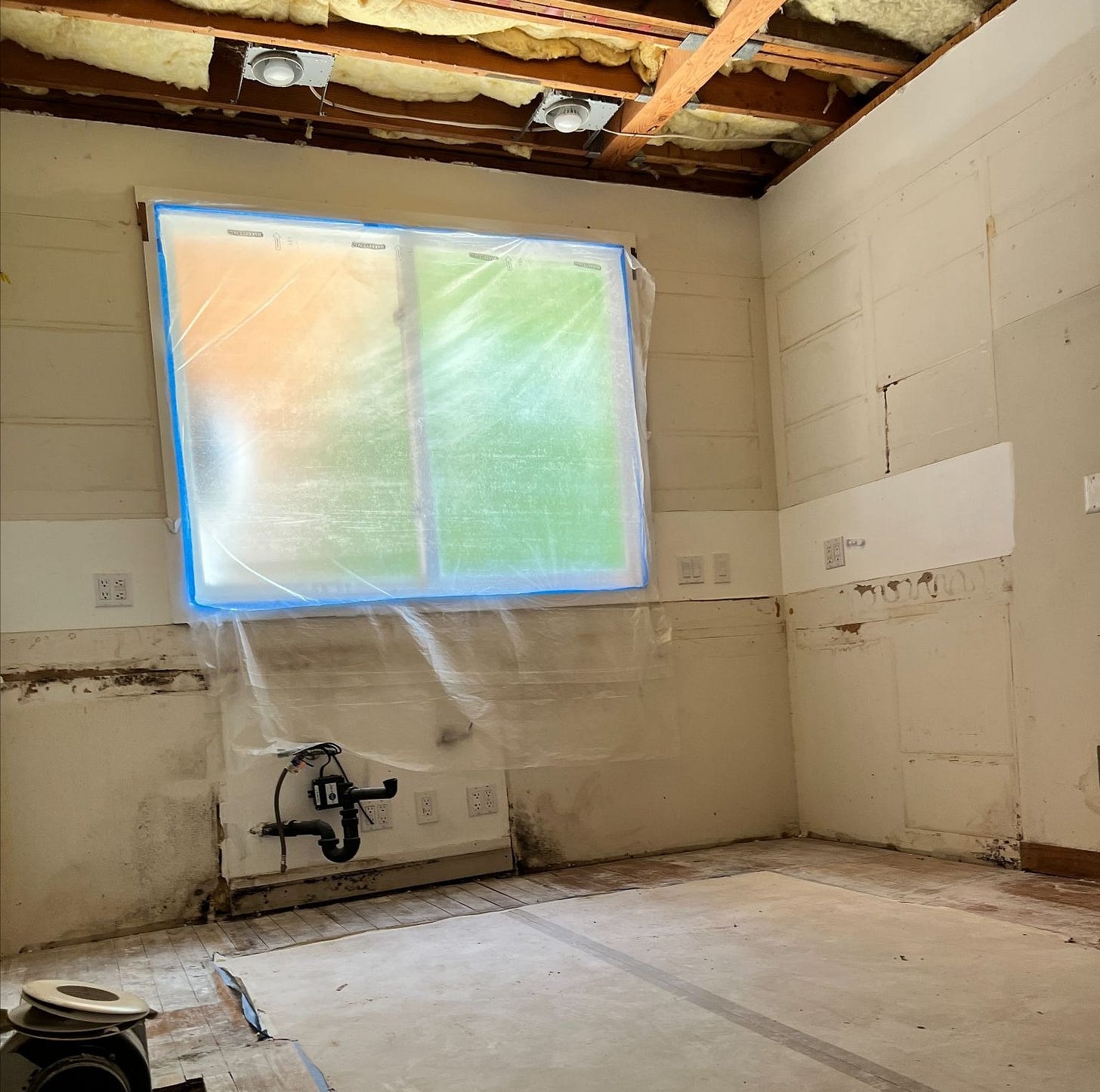 Empty kitchen space after demolition during home renovation Empty kitchen space after demolition during home renovation