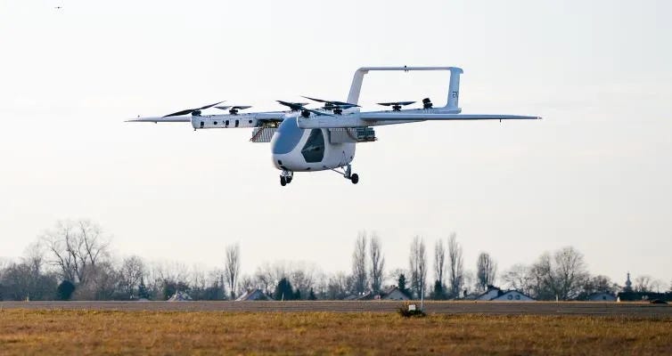 ERC System Romeo eVTOL prototype in hover flight over an airfield with eight rotors deployed