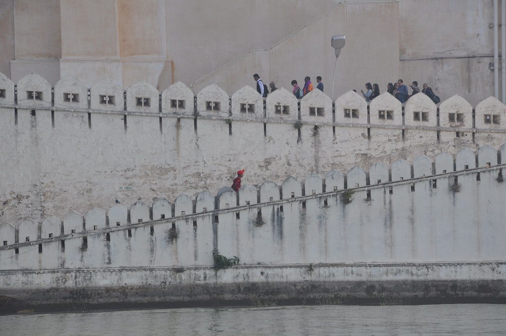 "Visitors walking up the ramp to the City Palace in Udaipur" by scupperssf is licensed under CC BY 2.0.