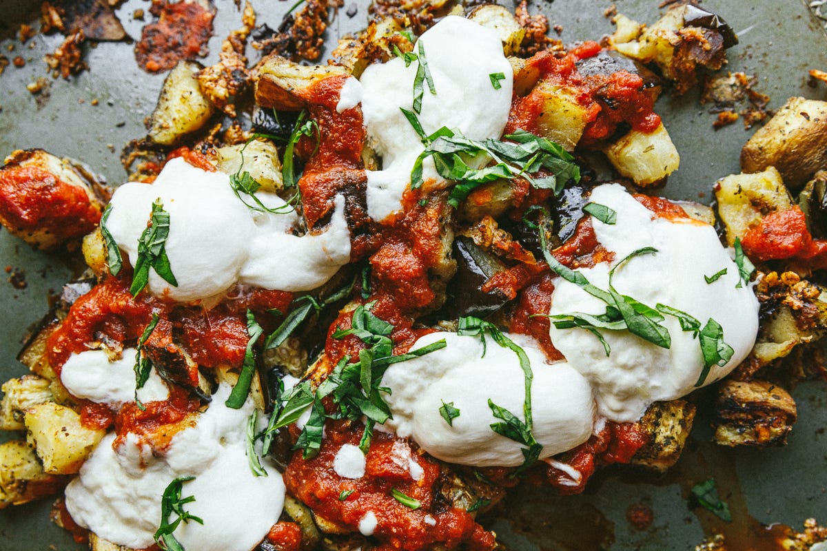 sheet pan eggplant parmesan with fresh basil.