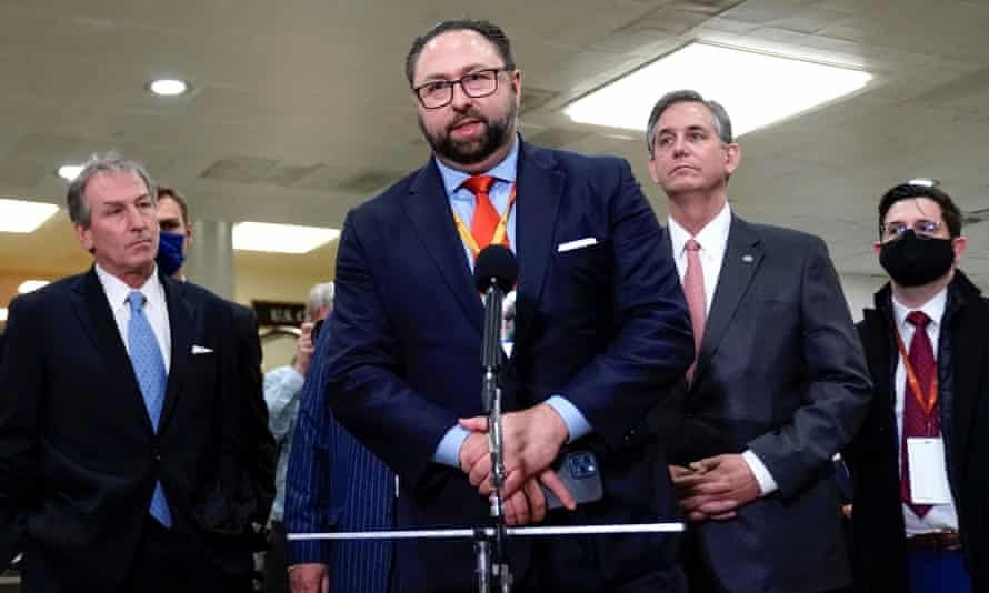 Jason Miller, middle, at Trump’s second impeachment trial in February. 