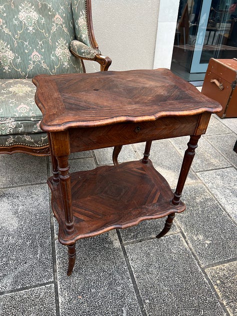 Three photos from an outdoor brocante antiques market on the grounds of a historic château in Durtal, France, with tables of vintage goods.