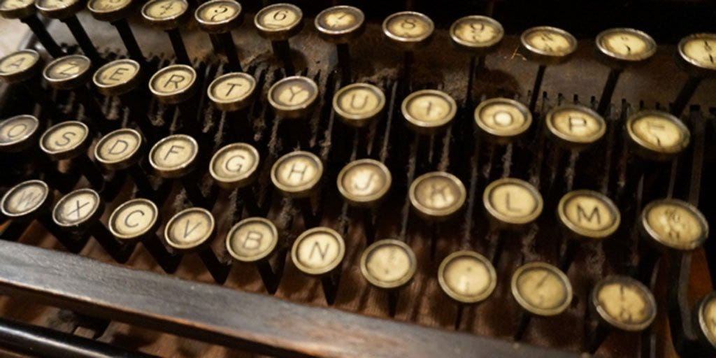 closeup of vintage typewriter keys entreworship